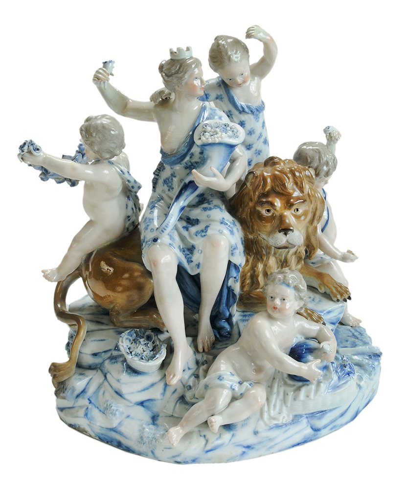 Meissen Allegorical Figure Group: circa 1900, Earth from series of four elements designed in 18th century by M.V. Acier and J.J. Schoenheit, showing Cybele seated on a lion cradling a cornucopia and surrounded by young female attendan