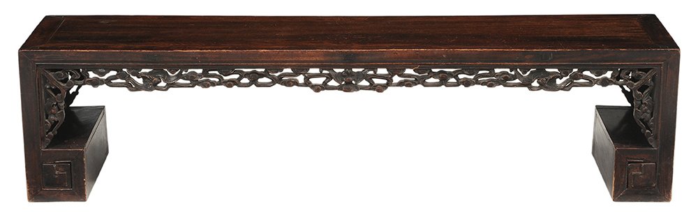 Antique Chinese Carved Hardwood Low: Altar Table carved hardwood with rich brown color throughout, pierced skirt carved with stylized bats and clouds, carved end panels, corners each set with a single small drawer, 15 x 62 x 15 in., surf