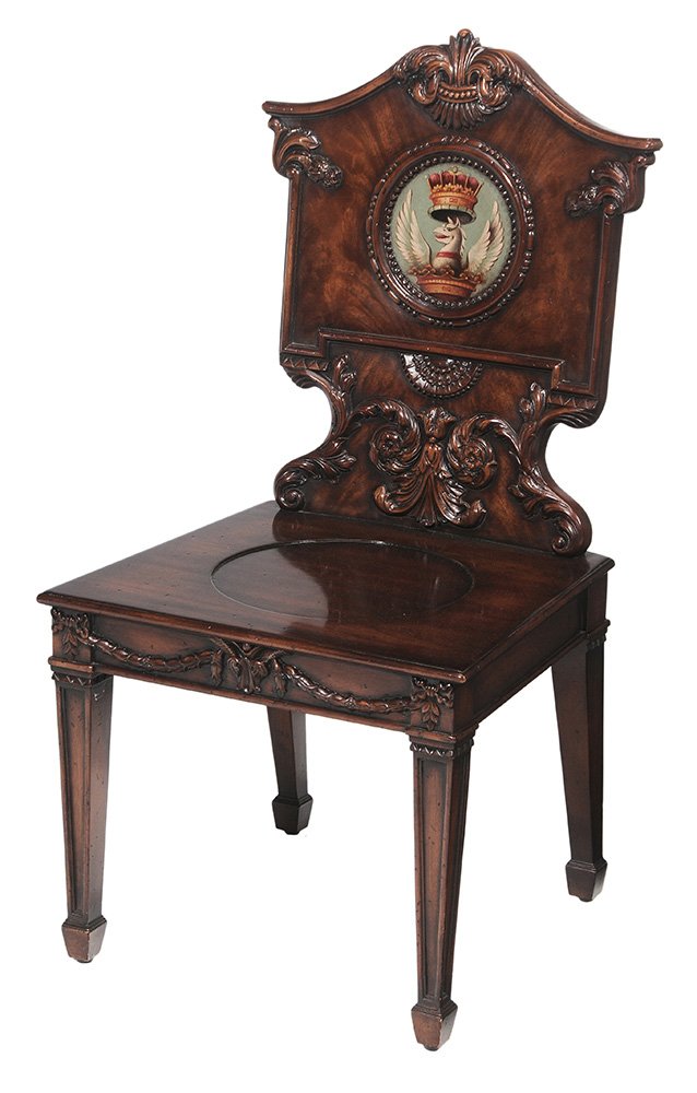 Regency Style Carved Mahogany and: Polychromed Hall Chair modern reproduction by Theodore Alexander Furniture after the original at Althorp, ancestral home of the Spencer family, stylized leaf and feather carved back centering a polych