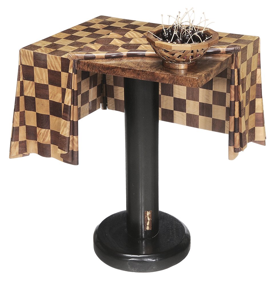 Perry Policicchio "Life is a Bowl Full: of Cherries" Table Hawaii, 2005, rectangular table of koa wood and other mixed light and dark figured hardwoods and simulating a rippling checked tablecloth, ebonized pedestal base, sitting on top is 