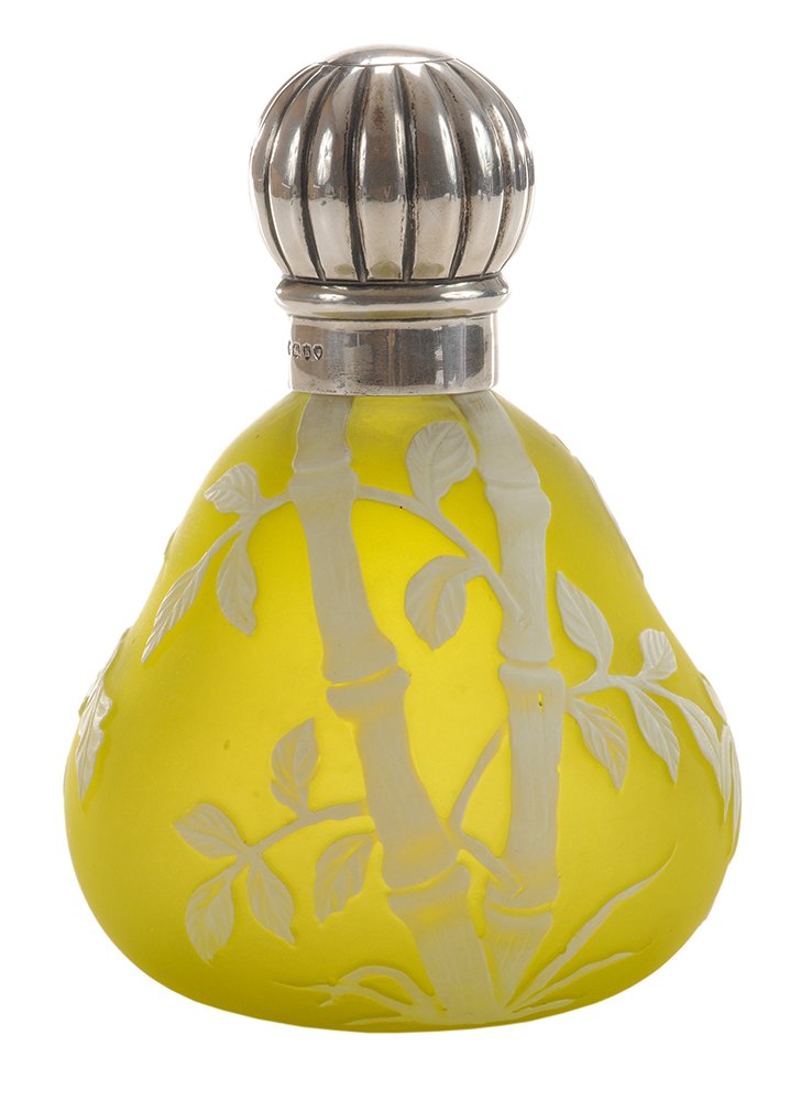 Thomas Webb & Sons Cameo Glass Perfume: Bottle English, 1885-6, fig-shaped, white over citron, carved with exotic fronds, bamboo and palms, English silver mount with gadrooned screw cap, marks for Army & Navy Cooperative Society Ltd. (F