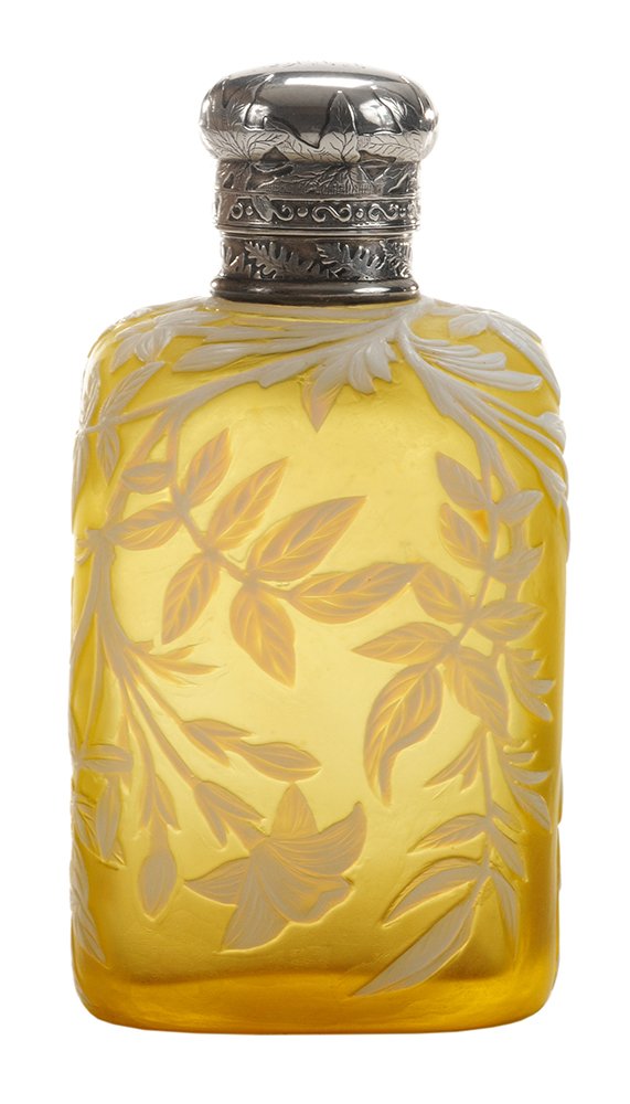 Thomas Webb & Sons Cameo Glass Perfume: Bottle English, circa 1890, white finely carved clematis vine and flowers blanket this piece, citron ground, silver mounting, locking hinged cap finely engraved and with monogram, unmarked, 4-3/4 in.