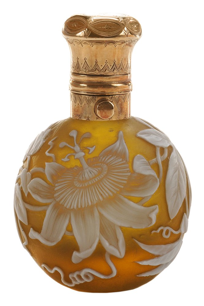 Extremely Rare Thomas Webb & Sons: Cameo Glass Perfume Bottle English, circa 1890, splendidly carved opal glass passion flower with leaves and tendrils on rare raisin ground, 14 kt. gold (test) mount delicately engraved, push piece ope