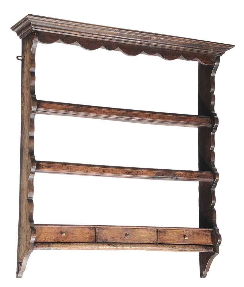 British Antique Oak Hanging Plate Rack: possibly Welsh, 18th/19th century, oak throughout, three shelves and three dovetailed short drawers, scalloped ends, 39 x 37 x 8 in. generally good condition with scattered stains and surface distress