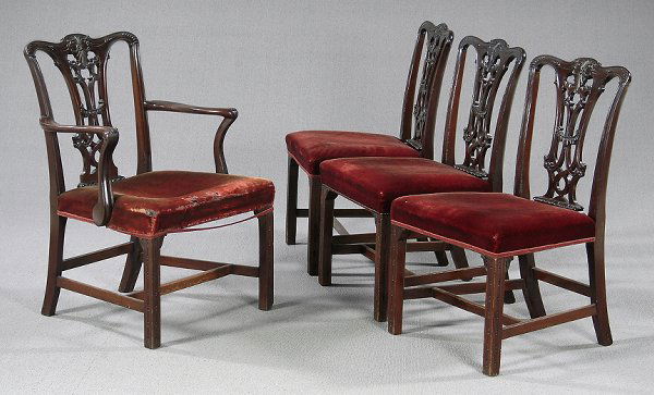 Mahogany Chippendale style chairs: one armchair and three side chairs with finely carved splats, cross-stretcher bases, molded front legs, mahogany throughout, tag beneath one "Arthur Smith Antiques, Savannah, Georgia", shoes and one m