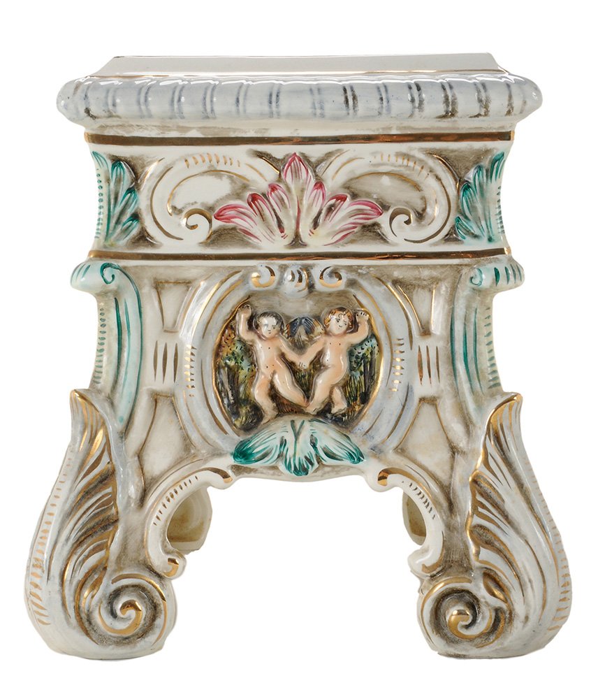 Capodimonte Porcelain Garden Seat: Italian, 20th century, floral-painted square top, gilt border, molded body with scrolling floral devices, vignettes of putti in landscape and holding hands, scrolling acanthus leaf legs, 15 in. minor