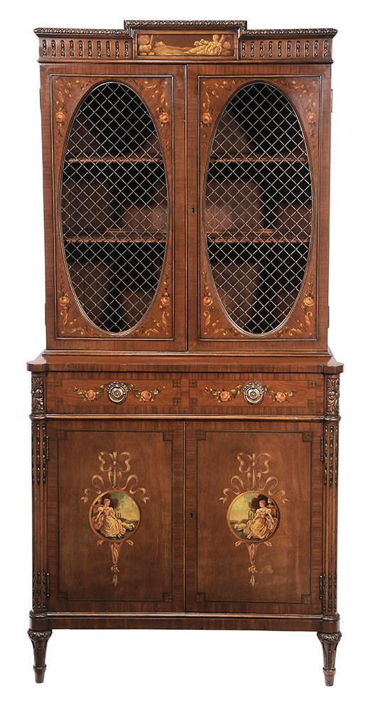 Adam Style Paint-Decorated Grille-Door: Cabinet late 19th/early 20th century, painted floral garlands and spandrels, figured veneers, the cornice and doors with painted classical scenes, grille doors opening to shelved interior, single draw