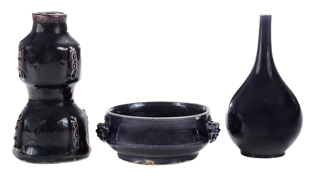Three Aubergine-Glazed Porcelain: Vessels Chinese, Ming Dynasty and later: a Ming flanged double-gourd vase, lower bulb of campana shape, upper bulb shouldered below a short neck, each section encircled by four vertical notched figure