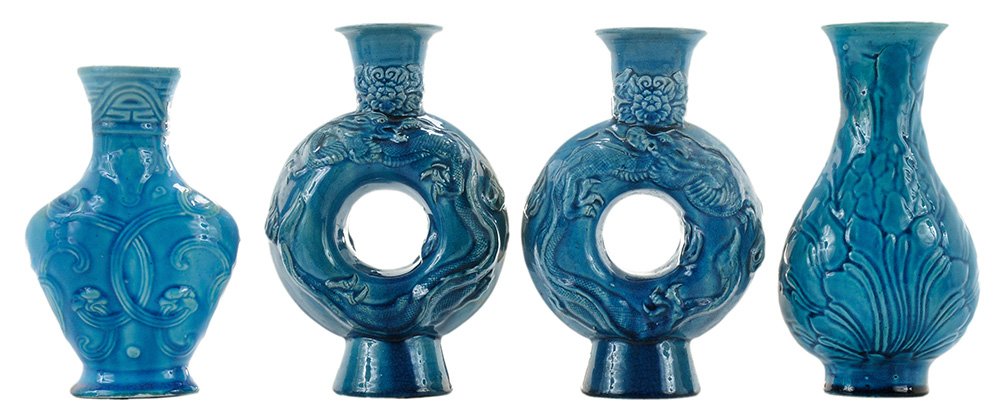 Four Turquoise-Glazed Vases: Chinese, ovoid molded vase with overall floral design, unglazed foot and base, 8-3/4 in.; pair moon flasks with dragons chasing a flaming pearl on both sides, floral decoration, 8-1/2 in., [firing fla