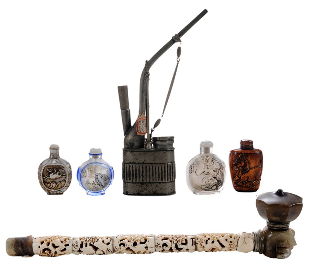 Six Chinese Smoking-Related Articles: [hookah] style white metal tobacco pipe with brush, tamper and tweezers in side compartments, hallmark on cover of well, probably mid-20th century, 10 in., [surface discoloration]; carved bone and gre