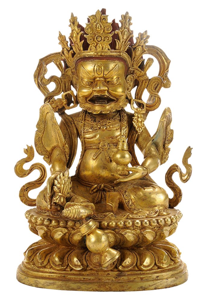Gilt-Decorated Sino-Tibetan Bronze: Figure of Kubera seated figure of the God of Wealth in Lalitsana position with elaborate headdress and right foot supporting a vase, double-lotus throne, heavily gilt and decorated in red, underside w