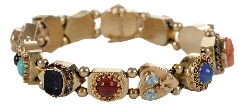 14 karat Yellow Gold and Gemstone: Slide Bracelet contemporary, with 12 various slides ornamented with cultured pearls, peridot, cameo, garnet, turquoise, black onyx intaglio, carnelian, blue topaz, coral, tourmaline, and tiger eye, 7 