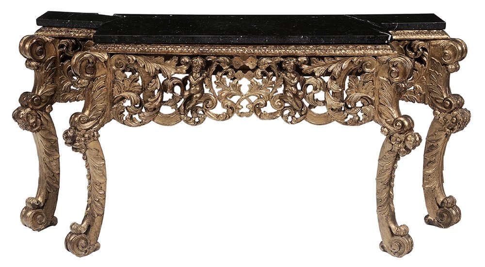 Italian Baroque Style Carved and: Giltwood Marble Top Pier Table probably 19th century, thick black marble top resting on elaborate leaf and shell carved framed scrolled legs and feet, 36-1/4 x 67-1/2 x 26-1/2 in.