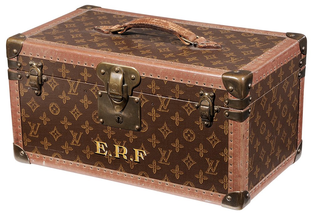 Louis Vuitton Toiletry Travel Case: France, 20th century, monogrammed canvas-covered hard case with leather edges with bands of "VL" monogram in red, brass corners, leather bottle holders on front and back inside walls, one removable tr