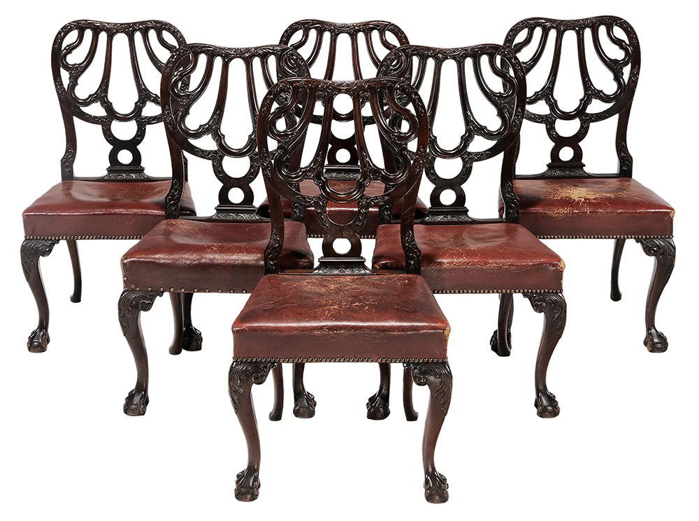 Set of Six Chippendale Style Carved: Mahogany and Leather-Upholstered Dining Chairs late 19th century, each well-carved frame with rich dark patinated surface, set with red leather upholstery with brass tacking, 36 in.