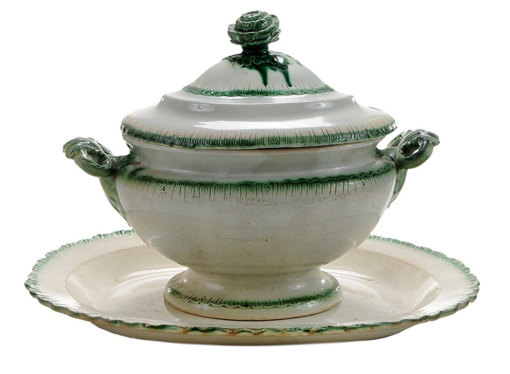 Creamware Tureen with Green Shell Edge: and Similar Herculaneum Platter Staffordshire, England, early 19th century, cream-colored earthenware, molded and incised shell-shaped rim with band of green glaze, large artichoke finial on tureen co