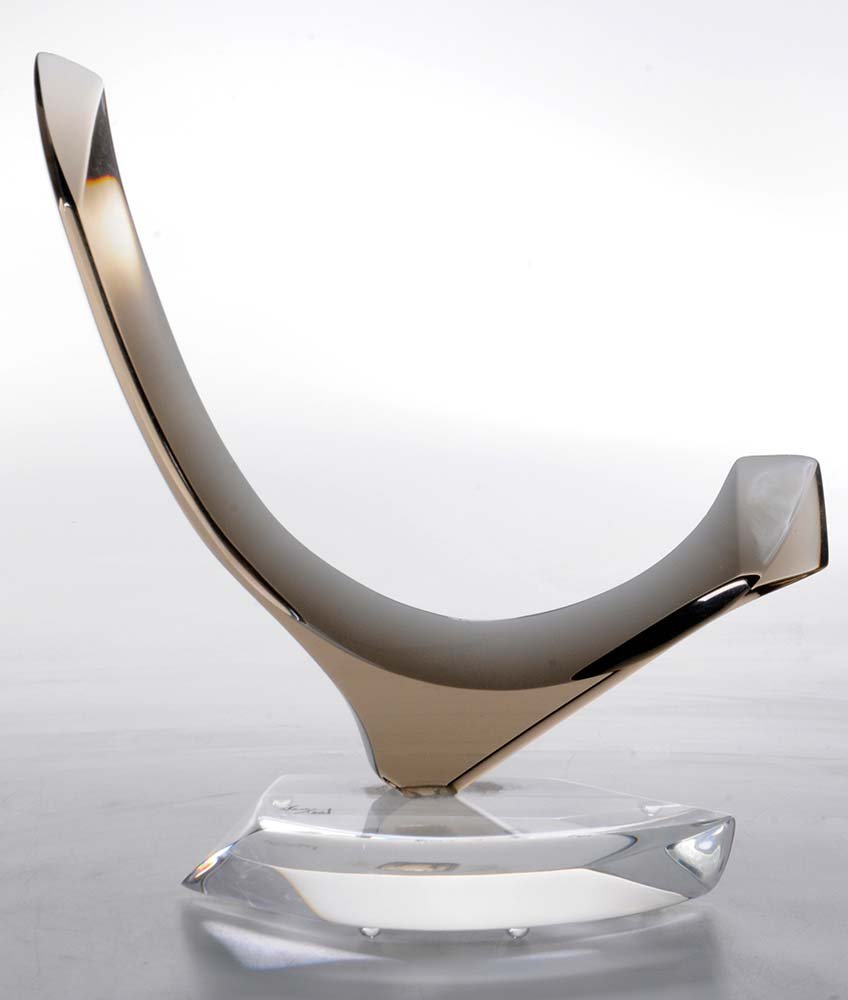 Hivo G. Van Teal: (Cuban, born 1976) Abstract acrylic sculpture, an early work in clear and smoked acrylic, curved form with faceted edges creating different shapes within the sculpture, mounted on a clear base, hand-s