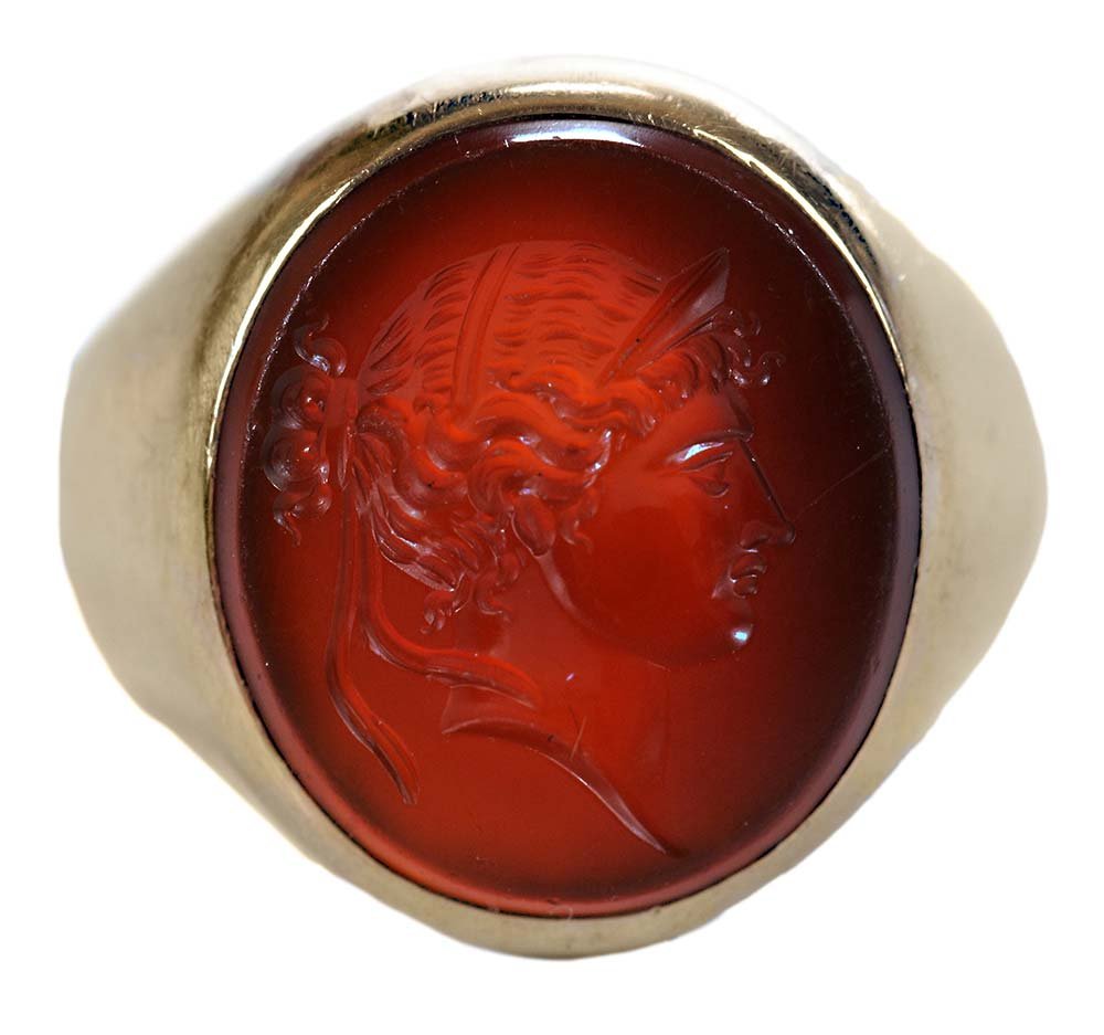 18 Karat Yellow Gold and Carnelian: Ring intaglio of Roman soldier, size 6-1/2 to 7, 7.8 grams. Condition: light wear. Provenance: Property of a Charleston Lady