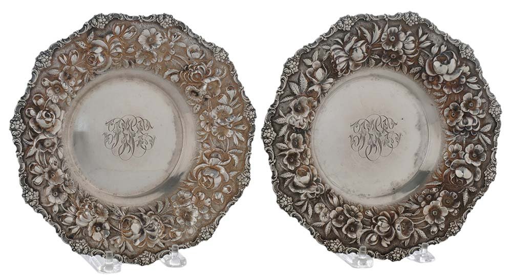 Two Steiff Sterling Wine Coasters: American, 20th century, round with floral repoussé decoration, marks for Steiff, "15" in a circle, "99B", monograms, 17.69 oz. T., 1-1/2 x 8-1/2 in.,. Condition: light scratches, dents. Provenance: P