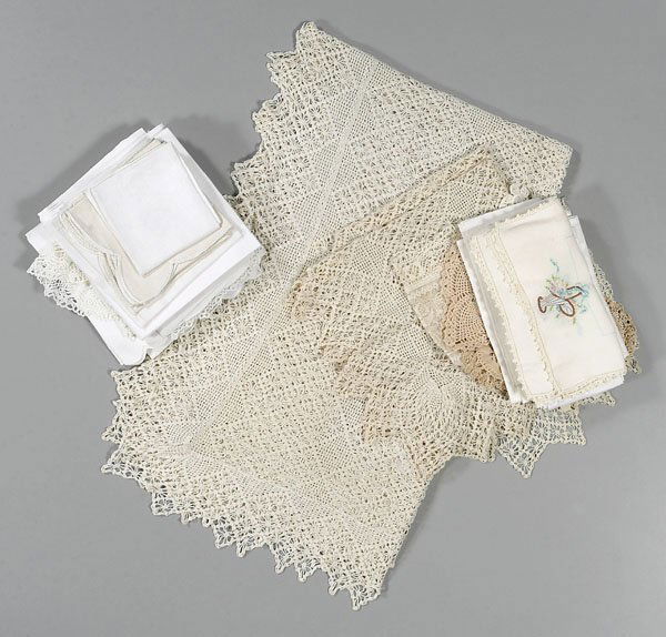 Box assorted linens: includes drawn work tablecloth, 69 x 22", several large damask tablecloths, one 90 x 70" with swag decoration, one 70 x 85", other sets of crocheted placemats, napkins, doilies, table runners, several