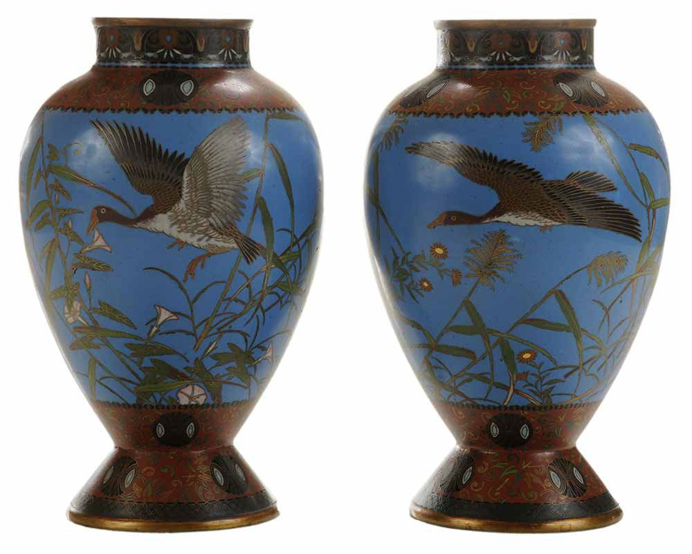 Pair Finely Enameled Cloisonné Vases: Japanese, late 19th/early 20th century, each with copper rim, stylized floral border over body with blue ground, geese in flight, flaring base with red ground and stylized flowers, unmarked, 10-1/2 in