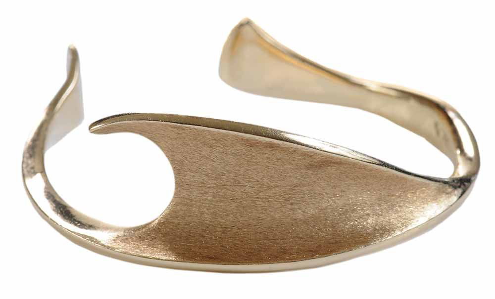 Ed Wiener 14kt. Forged Cuff: wave form, textured and polished, stamped "EW, 14K", with personal engraving inside, 5 in., 30.9 grams. Notes: Brunk Auctions makes no warranty or guarantee whatsoever regarding the jewelry, i