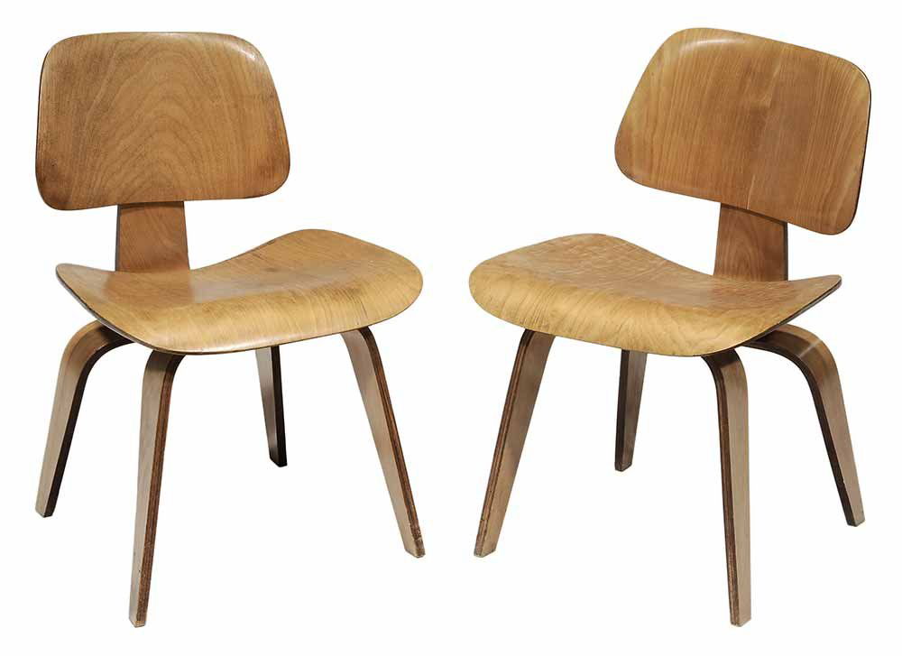 Pair of Charles Eames for Herman: Miller DCW Chairs each with stenciled label, Evans Products Company, Herman Miller Furniture Company, bentwood laminate construction, 29 in.. Provenance: To Benefit CarePartners Foundation