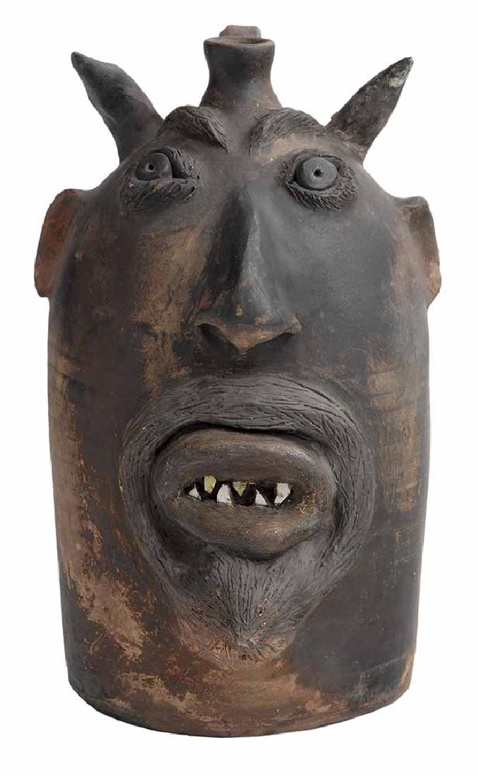 Earthenware Devil Jug: (attributed to Robert Brown, Arden, North Carolina, 1951-2015), unglazed form with varying coloration, applied facial features including large pronounced nose with large nostrils, thick lips surrounde