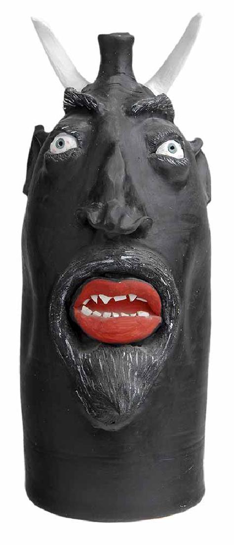 Monumental Robert Brown Stoneware: Devil Jug (Arden, North Carolina, Eureka, Montana 1953-2015), black paint to majority of form, applied facial features including inset white painted eyes with pierced blue pupils surrounded by incised