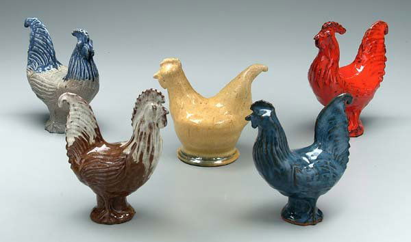 Five Jugtown roosters: red, yellow and blue/gray signed "Charles Moore", two signed "Charles Moore" with Jugtown stamp, streaked brown dated 1996 and yellow 1994, 7 in. to 8-1/2 in. (five pieces) Provenance: Bob Timberlake