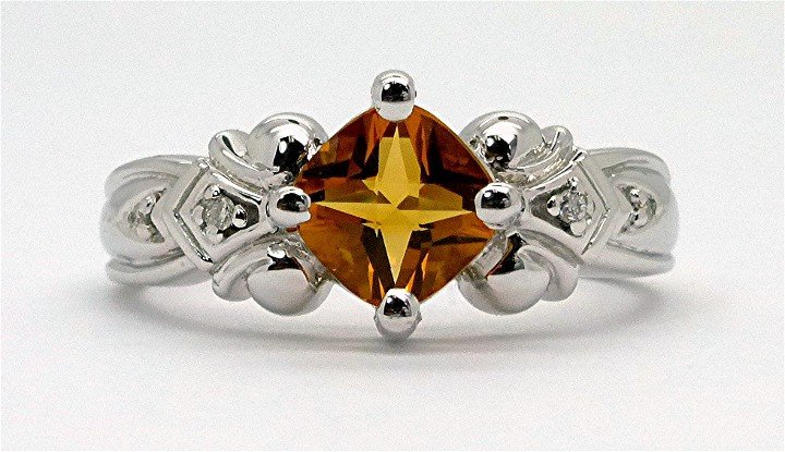 0.85ct Diamond and Citrine14K White Gold Ring: This 0.85ct diamond and antique cushion cut citrine 14k white gold ring consists of 4 round brilliant cut,bead set, G,SI1, natural and genuine diamonds with a weight of 0.04ct. In addition there are 1