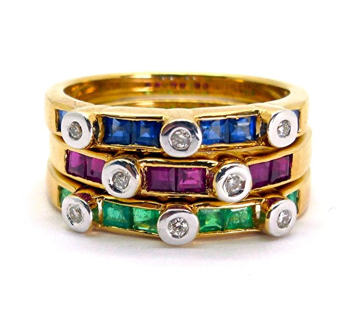 1.26ct Diamond Ruby Emerald and Sapphire Ring 18K Gold: This 1.26ct stackable ring consist of 18 channel set sqaure AAA ruby emerald and sapphire with total weight of of 1.17ct. Intersecting the gems are 6 bezel set natural and genuine G quality SI1 diamon