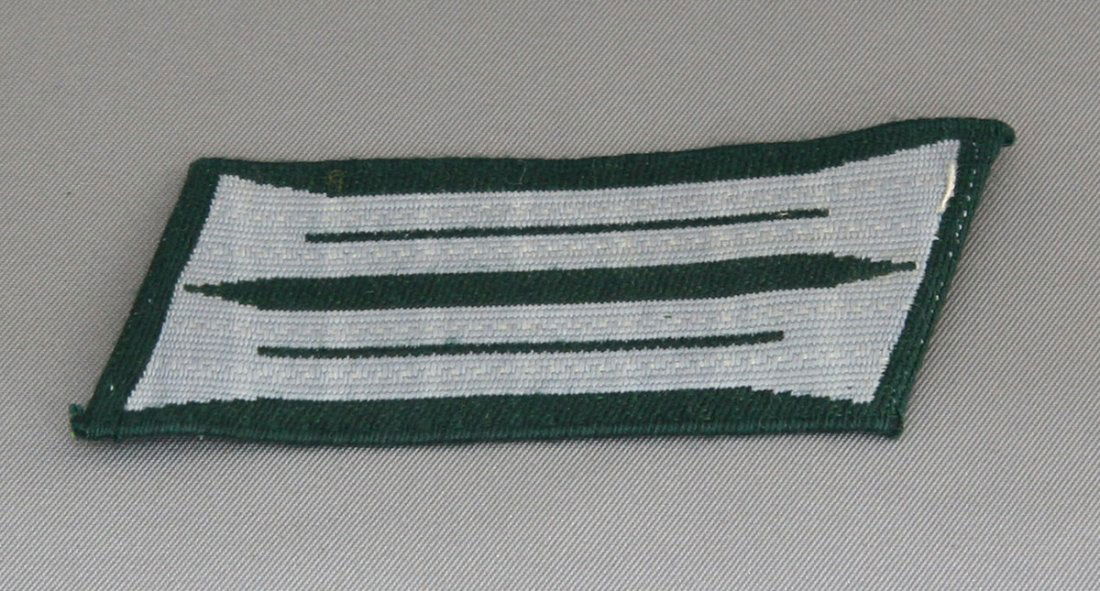 Collar Insignia: Green back, silver fabric detail, solid contstruction.