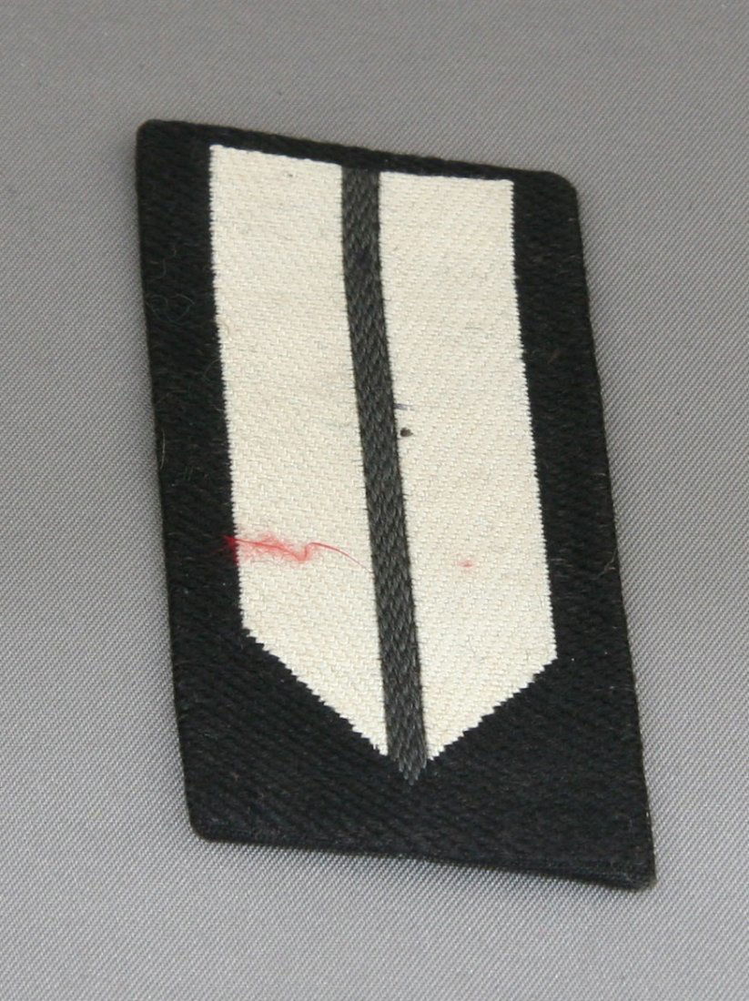 Collar Insignia: Black and white collar insignia. Solid construction.