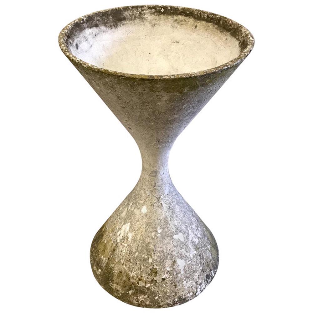 Willy Guhl Hourglass Planter, Smaller: 32" cast stone hourglass planter Measures: H 32 in. x Dm 18 in. The interior measures 17" D x 13" deep