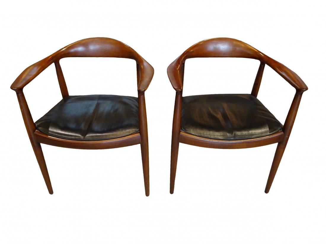 WEGNER: PR. "THE CHAIR": Pair of Hans Wegner The Chairs. Measures 30 inches in height by 25 inches in width by 20 inches in depth by 18 inches in seat height.