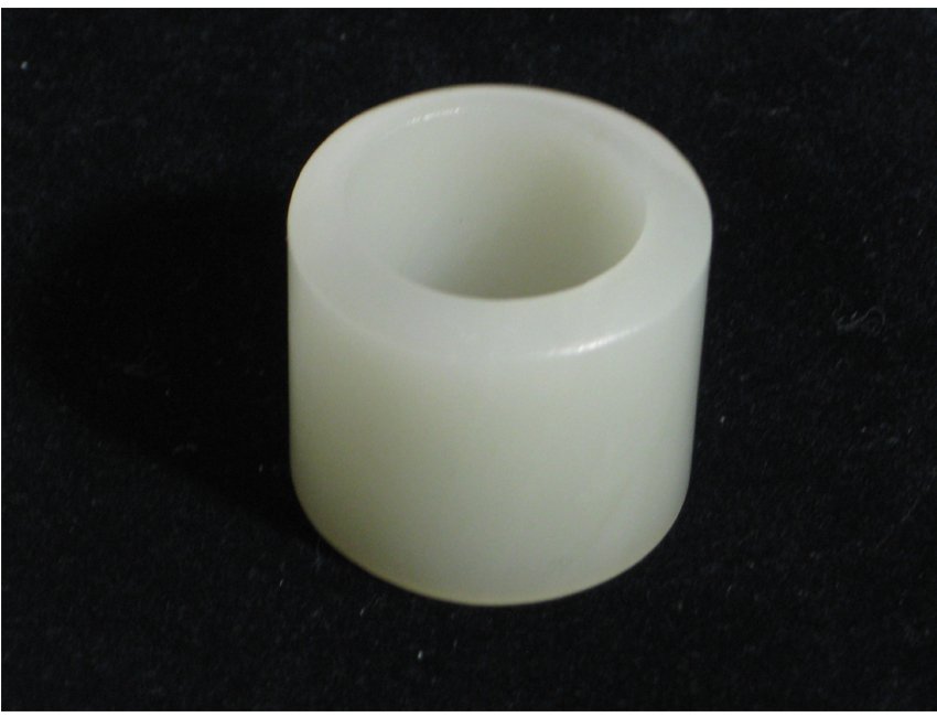 A white thumb hook ring: A white thumb hook ring, Qing dynasty. H 1"x 1 1/8"