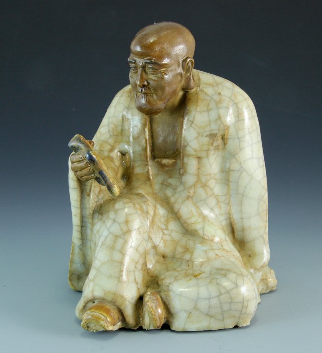 A Porcelain Figure Reading Arhat (1 of 6)