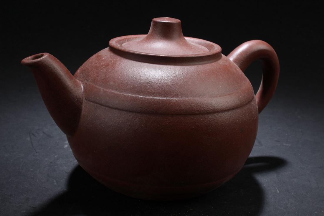 A Circular Chinese Plain Tea Pot Display (1 of 7)