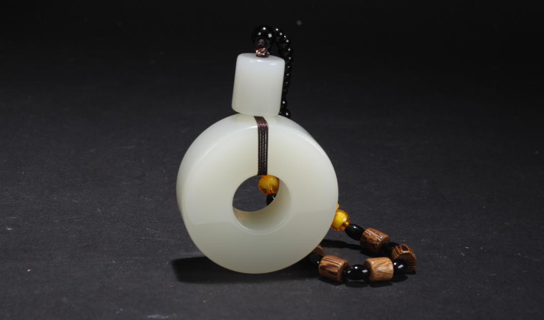 A Chinese Circular Estate Jade Display Figure (1 of 4)