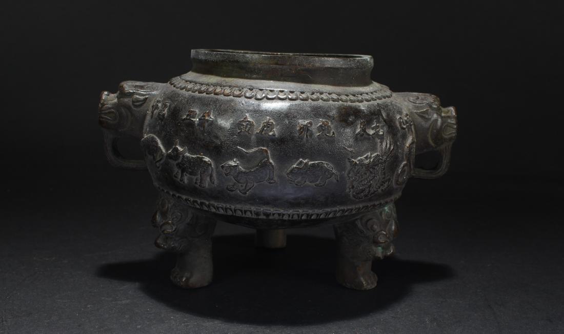 A Chinese Tri-podded Estate Duo-handled Censer Display: A Chinese Tri-podded Estate Duo-handled Censer Display . Height: 6.25 (inch). Width: 5.1 (inch).