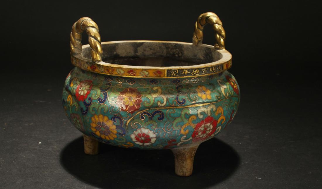 A Chinese Duo-handled Lidded Cloisonne Tri-podded: A Chinese Duo-handled Lidded Cloisonne Tri-podded Censer . Height: 5 (inch). Width: 6 (inch).