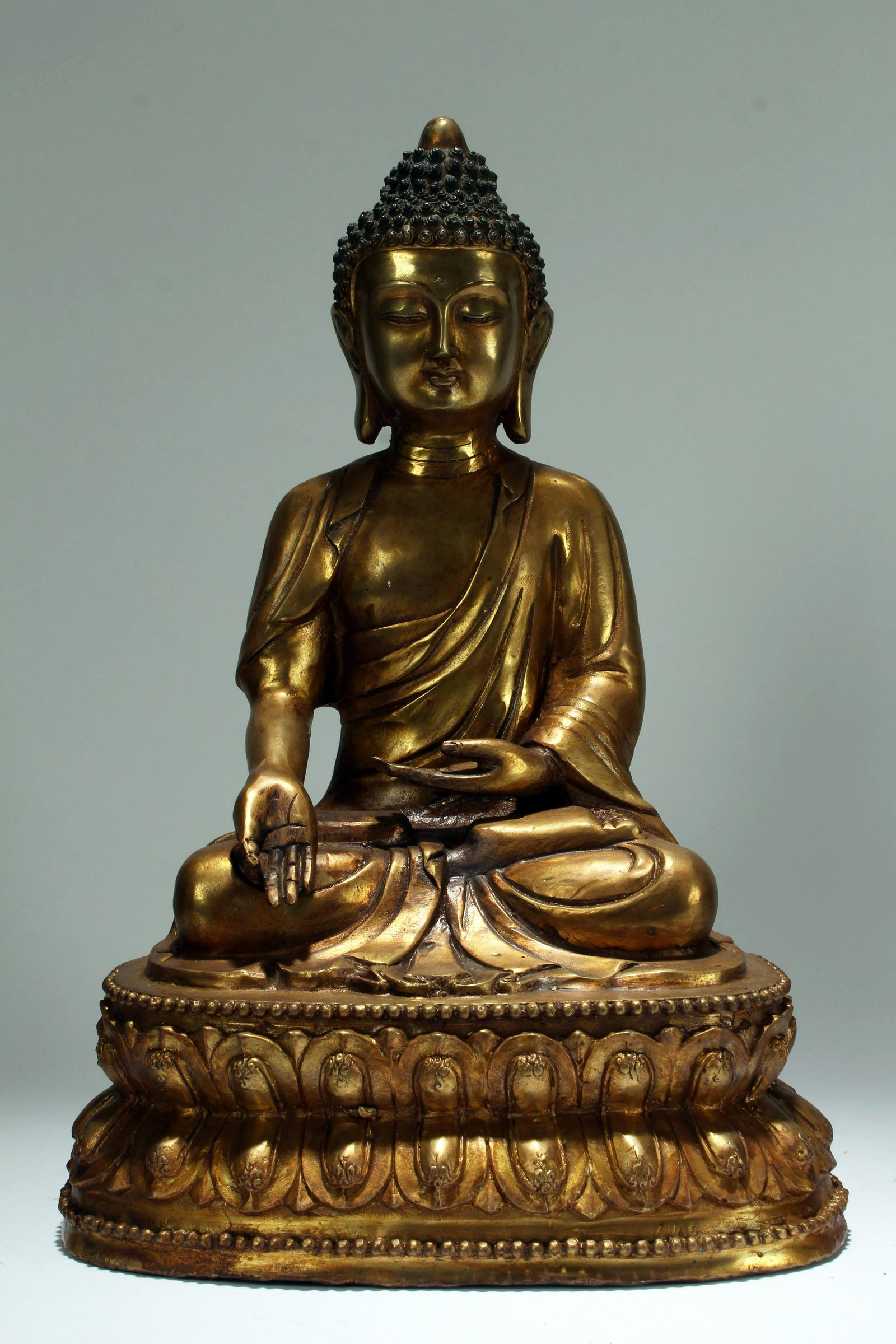 A Chinese Lotus-seated Pondering-pose Gilt Buddha: A Chinese Lotus-seated Pondering-pose Gilt Buddha Statue . Height: 16 (inch).
