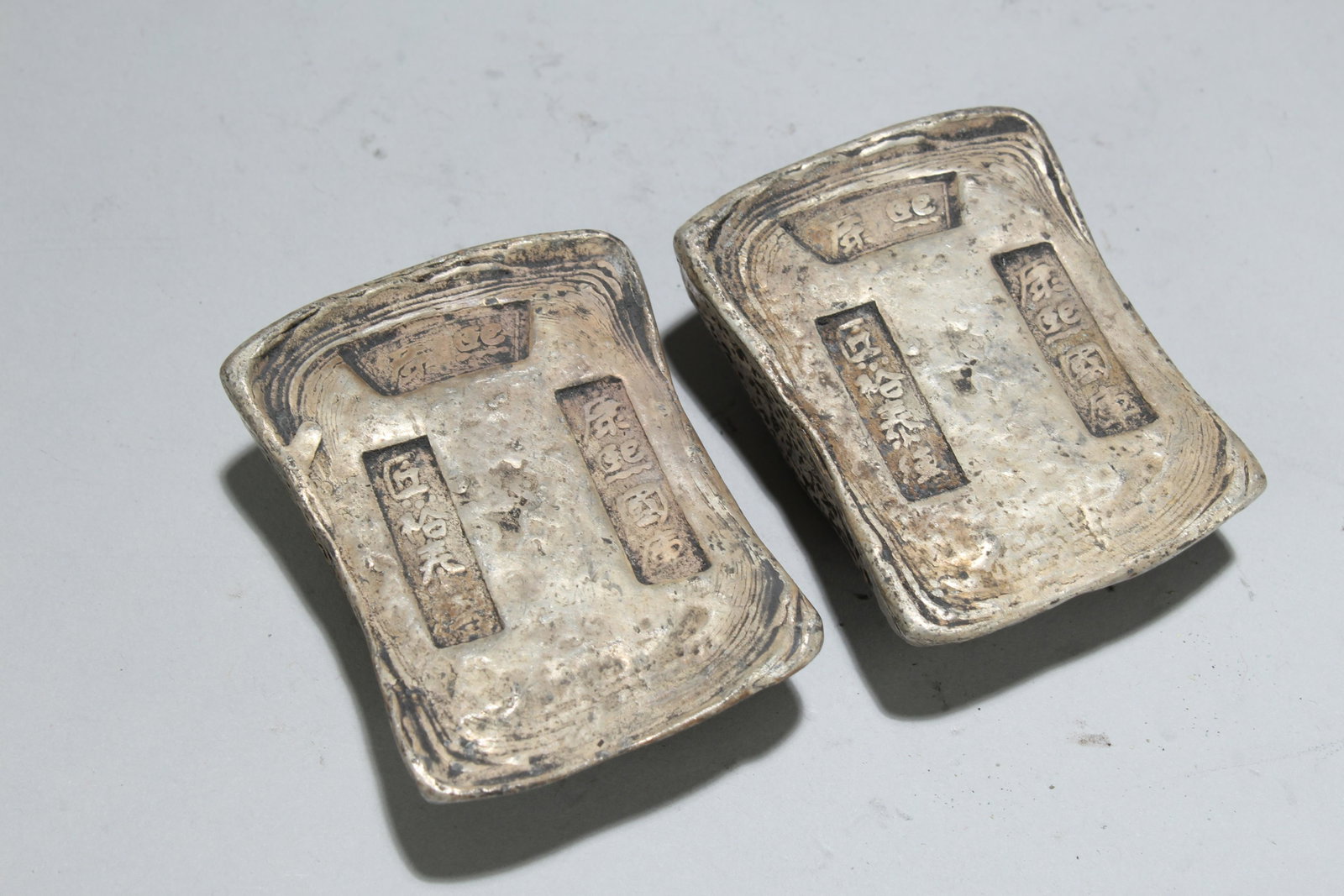 Two Chinese Money Bricks: Two Chinese Money Bricks. Height: 1.5 (inch). Length: 3 (inch). Width: 1.5 (inch).