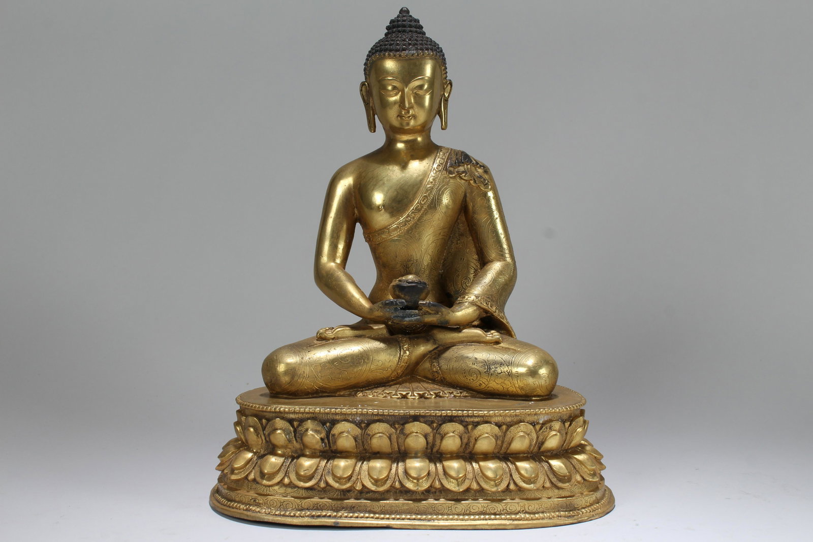 An Estate Chinese Gilt Lotus-seated Buddha Statue: An Estate Chinese Gilt Lotus-seated Buddha Statue . Height: 9.5 (inch).