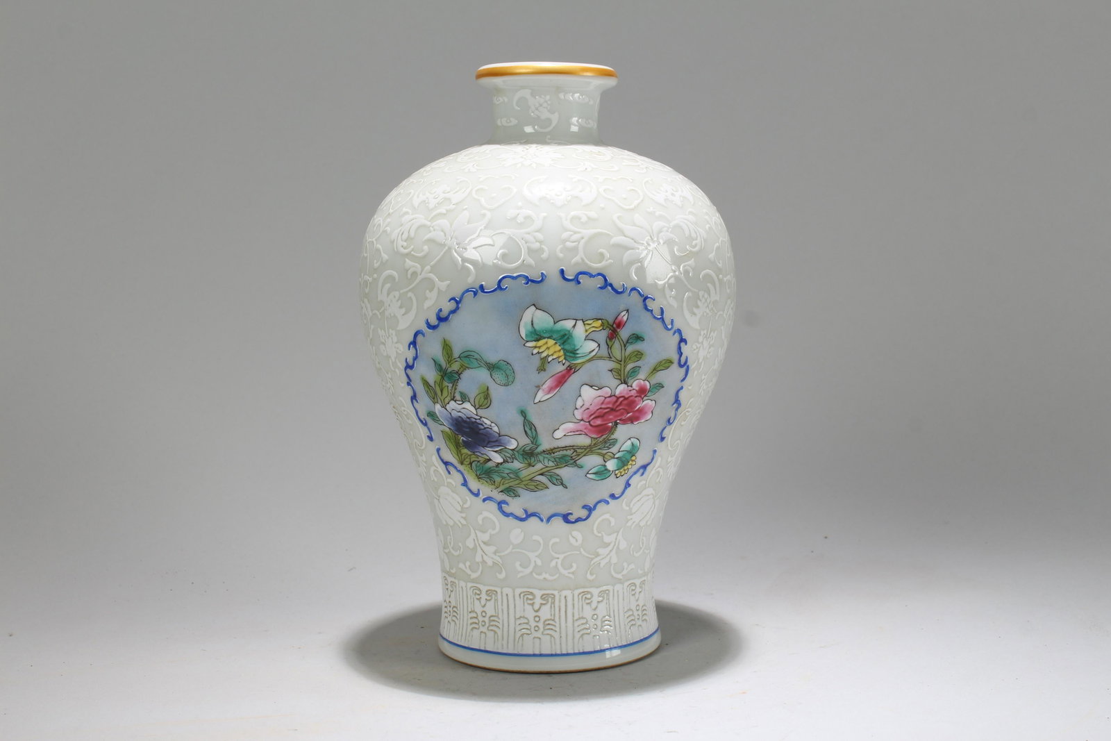 A Chinese Ancient-framing White Window-framing: A Chinese Ancient-framing White Window-framing Porcelain Vase . Height: 8.25 (inch).
