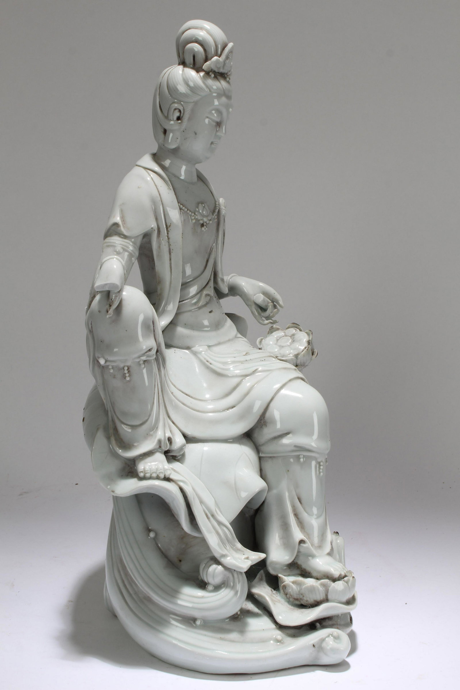 A Chinese Pondering-pose Chinese De Blac Porcelain: A Chinese Pondering-pose Chinese De Blac Porcelain Guanyin Statue . Height: 15 (inch).