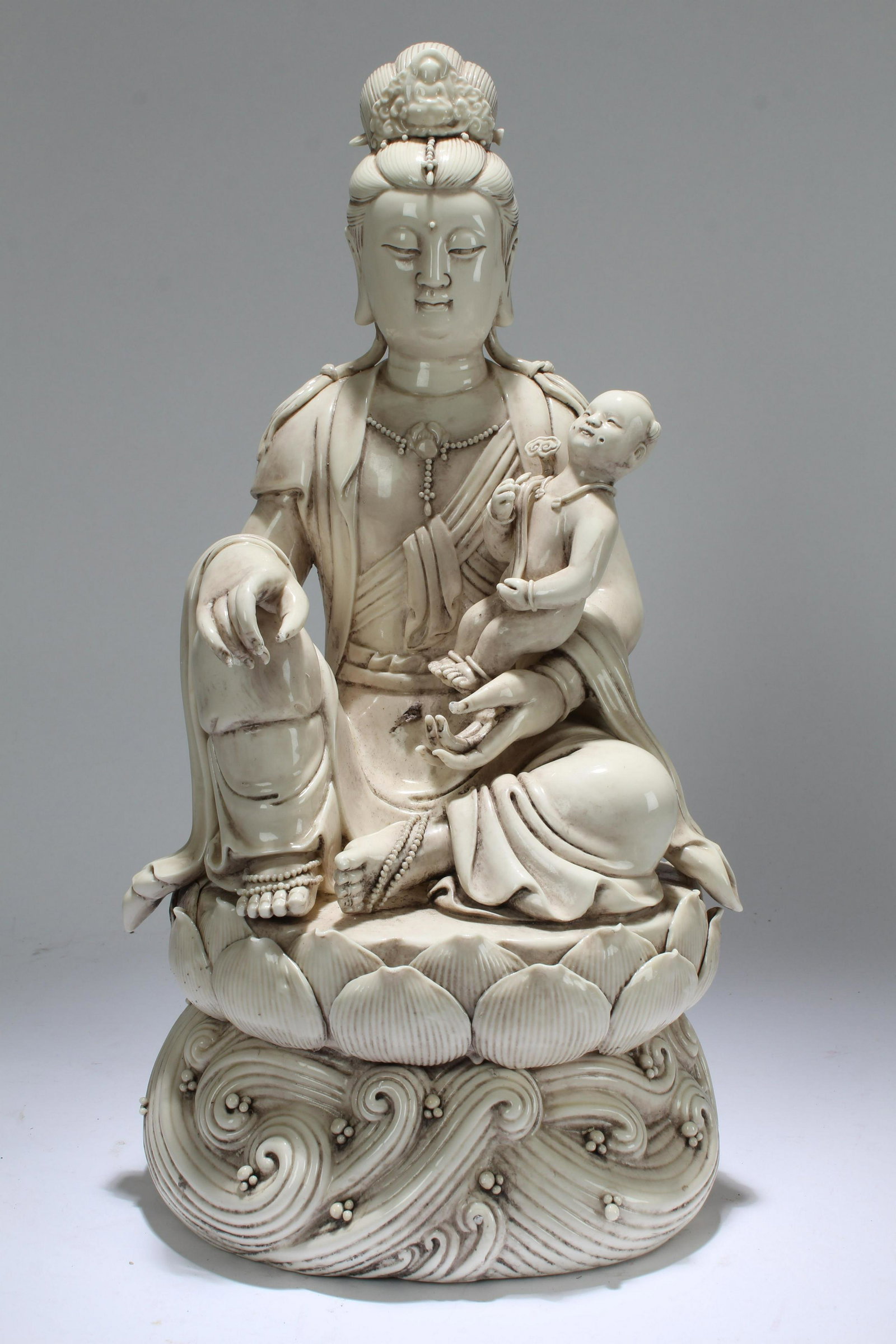 An Estate Chinese Joyful-kid De Blac Porcelain Guanyin: An Estate Chinese Joyful-kid De Blac Porcelain Guanyin Display Statue . Height: 16 (inch).