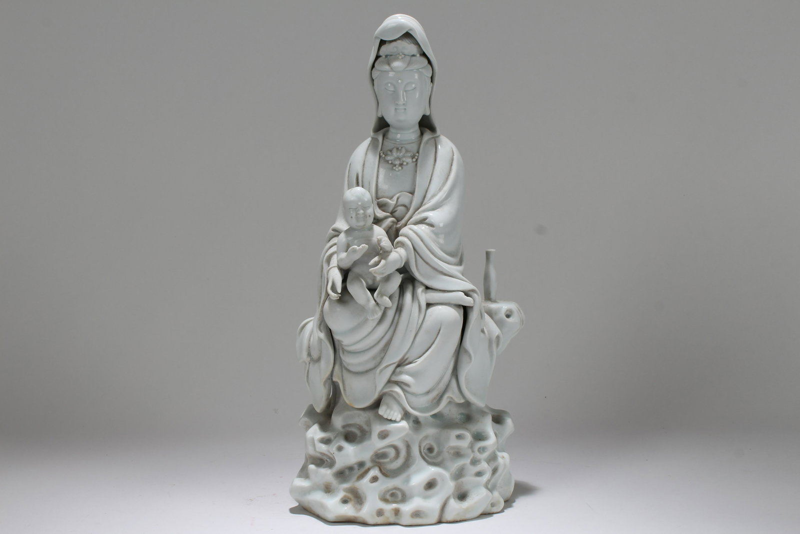 A Chinese Religious Guanyin De Blac Porcelain Statue: A Chinese Religious Guanyin De Blac Porcelain Statue . Height: 11.75 (inch).