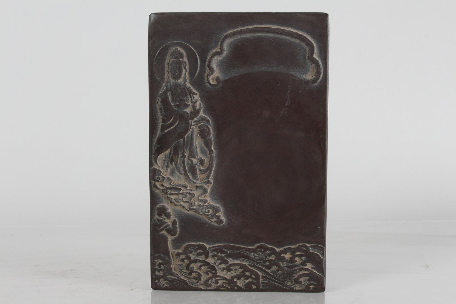 A Chinese Guanyin Fortune Inkstone: A Chinese Guanyin Fortune Inkstone. Height: 1 (inch). Length: 8 (inch). Width: 5 (inch).
